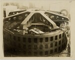 Worker Standing Beside Hydroelectric Turbine