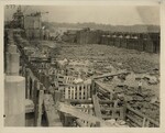 Wooden Enclosures for Rubble with Worker Standing in Middle