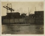 Canoe Floating Past Dam Construction