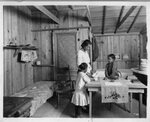 U.S. Nitrate Plant No. 2: Woman and young girls inside home by United States Government